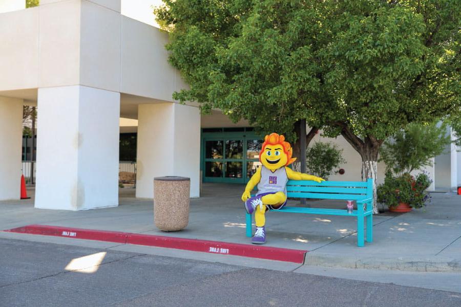 SJC Mascot Blaze sitting on bench